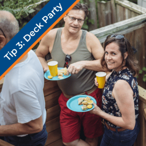 tip 3: deck party. two smiling people holding plastic plates with food outdoors